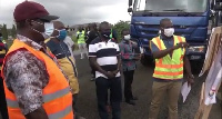 Roads and Highways Minister with the contractor during the inspection