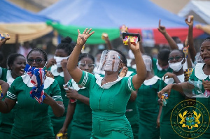 Group Of Nurses Welcoming The President During One His Tours