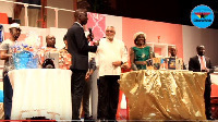 Former president JJ Rawlings cut the cake with is family and Uncle Ebo Whyte