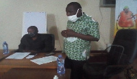 Mr Tampugre (standing) addressing the meeting