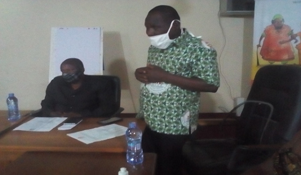 Mr Tampugre (standing) addressing the meeting