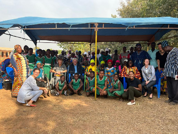 Her Excellency Harriet Thompson poses with some students