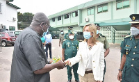 Spanish Ambassador to Ghana, Alicia Rico Perez del Pulgar presenting the items to Mr Ambrose Dery