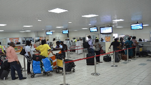 Passengers going through departure formalities at KIA