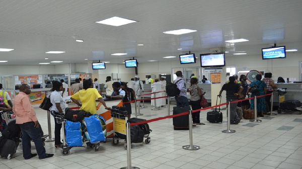 Passengers going through departure formalities at KIA