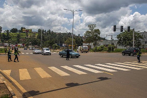 Police officers deviating vehicles on the first day of a national lockdown in Rwanda