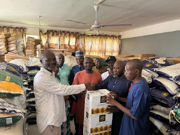 Kennedy Agyapong presenting items to locals