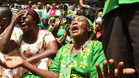 Mourners line di streets of Tanzania commercial capital Dar es Salaam to pay their last respect