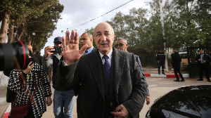 Algeria's presidential candidate Abdelmadjid Tebboune greets attendees