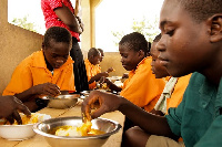 Some students enjoying a meal from the school feeding programme