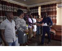 Anthony Mensah, the Asutifi North DCE congratulating the committee members after its inauguration