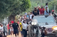 She received a handshake and cash from him before returning to her taxi.