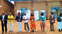 Visually impaired persons during the handover of walking sticks