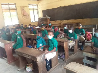 School children pictured wearing their nose masks