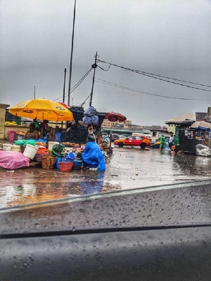 File photo of traders in the rain