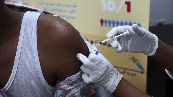 A man receives a dose of the Oxford-AstraZeneca COVID-19 coronavirus vaccine at the Jabra Hospital