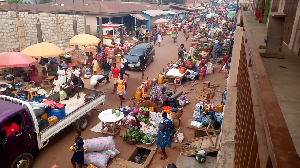 Most people were without face masks at the Agomanya market