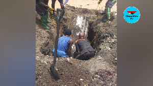 The men are seen here exhuming the coffin