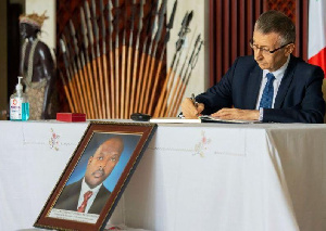 Ambassador of the Federal Republic of Russia to Burundi Valery Mikhaylov signs the condolences book