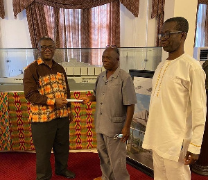 Evangelist, Togo Jesus (middle) making the donation at the Cathedral Secretariat