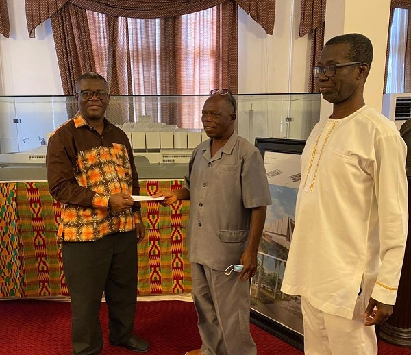 Evangelist, Togo Jesus (middle) making the donation at the Cathedral Secretariat