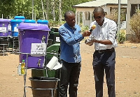 Dr Josephat Nyuzaghl demonstrating proper handwashing