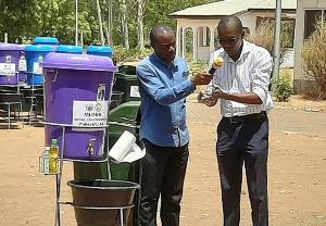 Dr Josephat Nyuzaghl Demonstrating Proper Handwashing 