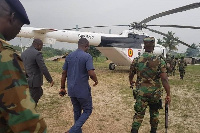 Defence Minister, Dominic Nitiwul and John Peter Amewu being accompanied by the military