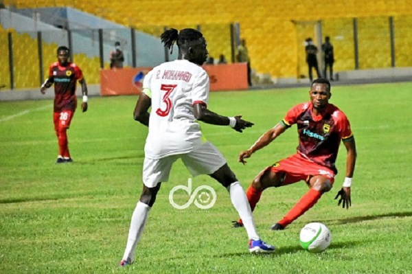 Latif Anabila (red jersey) in action for Kotoko