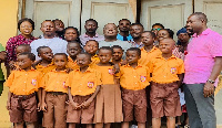 The NPP Chairman in a group picture with some of the pupils