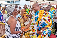 two traditional leaders exchange greetings