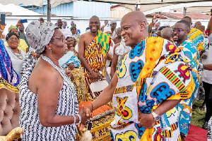 two traditional leaders exchange greetings