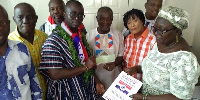 Prince Appiah [in smock] submitting his nomination forms