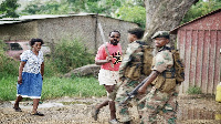 South African Defense forces troops on a foot patrol in the troubled KwaZulu township