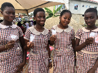 A photo of some of the students holding menstrual cups