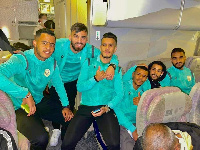 JS Saoura players in a plane during the trip to Ghana