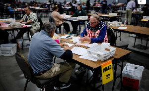 Electoral workers count votes during the 2024 U.S. presidential election