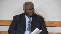 Kenya's former President Mwai Kibaki follows proceedings at the High Court