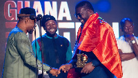 Kotoko CEO (right) receives an award for the club