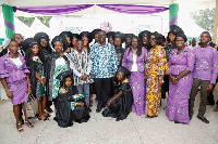 The graduates in a group photograph with the dignitaries