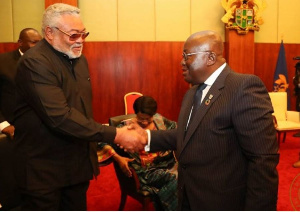 President Nana Akufo-Addo in a handshake with Former president J.J Rawlings