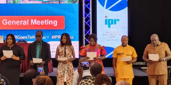 Koku Anyidoho (far right) takes oath of office with other inductees