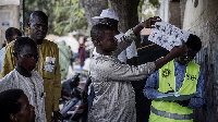 Ballots are counted after the closing of the voting operations at a roadside voting station