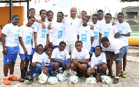 Andre Ayew with some of the children