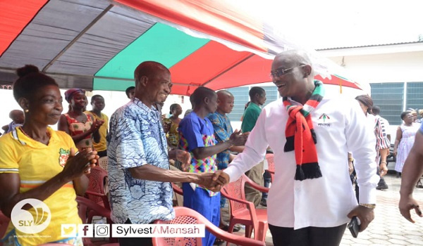 NDC flagbearer hopeful, Sly Mensah interacting with party members during campaign tour