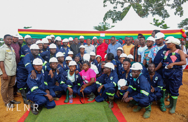 George Mireku Duker with some workers