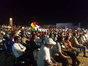 Hundreds have gathered at the forecourt of Ken City Media to watch 