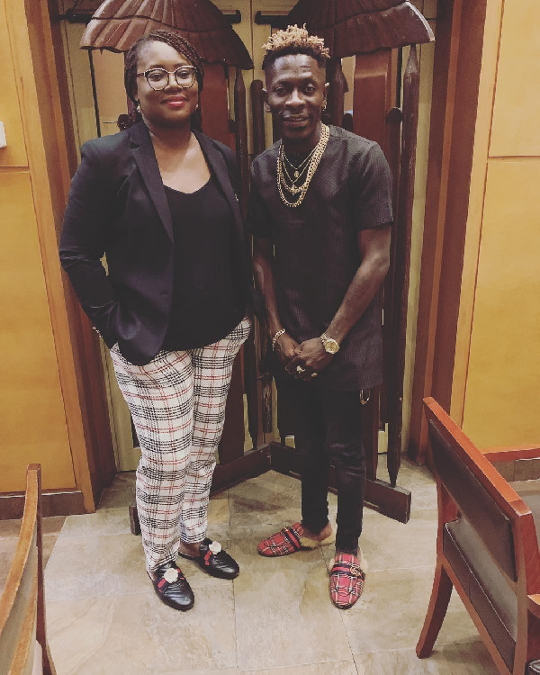 Dancehall artiste, Shatta Wale and Theresa Ayoade, the Chief Executive Officer of Charter House