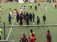 Some police officers took a photo with Kotoko's Fabio Gama after their WAFA game