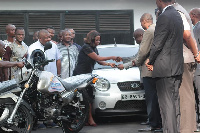 Lydia Alhassan presenting the keys to the automobiles to Prof Oduro Owusu